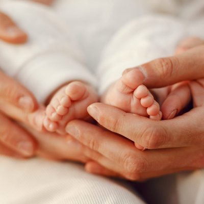Parents with daughter. Family in a park. Newborn girl.